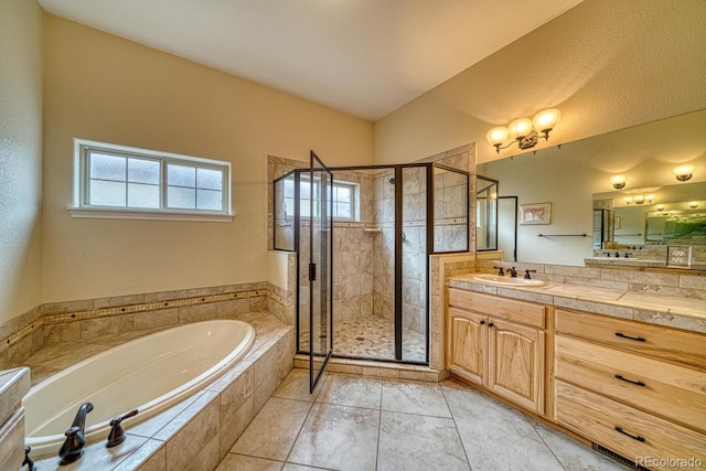 bathroom with tile patterned flooring, vanity, and independent shower and bath