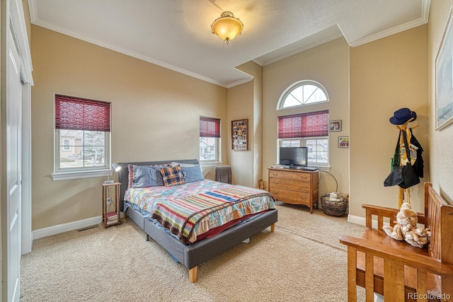 bedroom featuring carpet floors, multiple windows, and ornamental molding