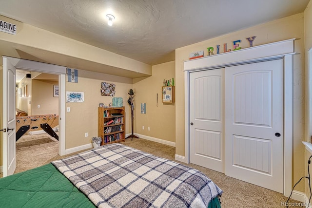 carpeted bedroom featuring a closet