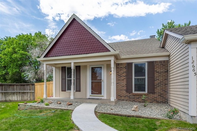 12665 Grove Ct, Broomfield, CO 80020 - view of front of house with brick siding and covered porch
