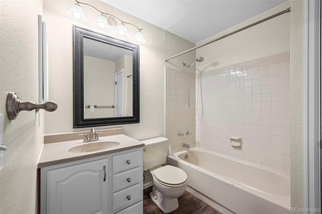 12665 Grove Ct, Broomfield, CO 80020 - bathroom featuring vanity,  shower combination, wood finished floors, and a textured wall