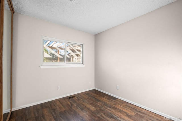 12665 Grove Ct, Broomfield, CO 80020 - spare room featuring dark wood finished floors and a textured ceiling