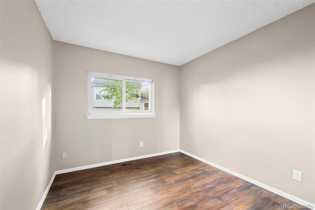 12665 Grove Ct, Broomfield, CO 80020 - spare room with dark wood finished floors and baseboards