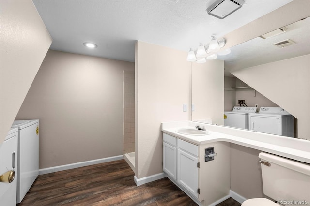 12665 Grove Ct, Broomfield, CO 80020 - full bath featuring washer and clothes dryer, vanity, wood finished floors, walk in shower, and recessed lighting
