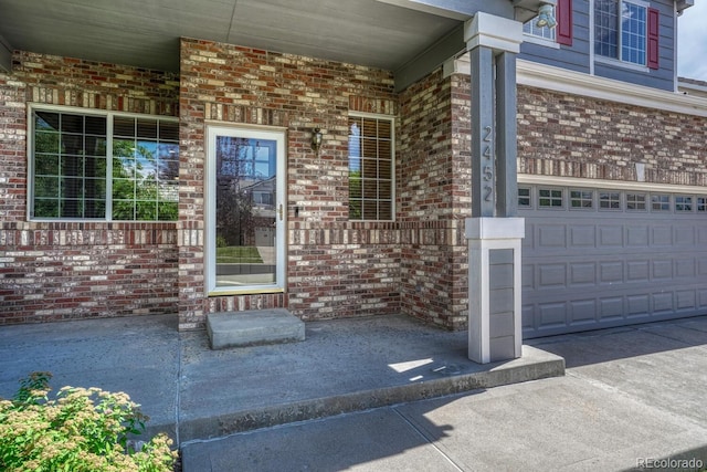 2452 S Andes Cir, Aurora, CO 80013 - property entrance with a porch and brick siding