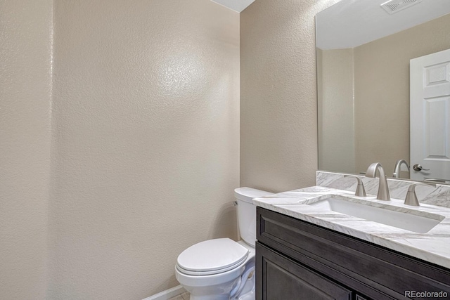 2452 S Andes Cir, Aurora, CO 80013 - half bathroom with vanity and a textured wall