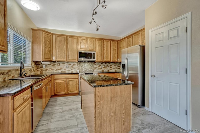 2452 S Andes Cir, Aurora, CO 80013 - kitchen featuring stainless steel appliances, a center island, light marble finish floors, and dark stone counters