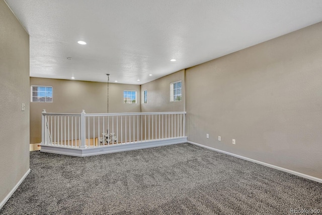 2452 S Andes Cir, Aurora, CO 80013 - empty room featuring carpet flooring, recessed lighting, and healthy amount of natural light