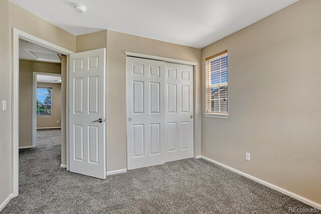 2452 S Andes Cir, Aurora, CO 80013 - unfurnished bedroom featuring carpet floors and a closet