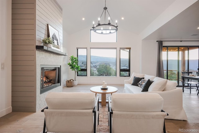 103 Paintbrush Way, Glenwood Springs, CO 81601 - living room featuring a chandelier, wood finished floors, a tile fireplace, recessed lighting, and high vaulted ceiling