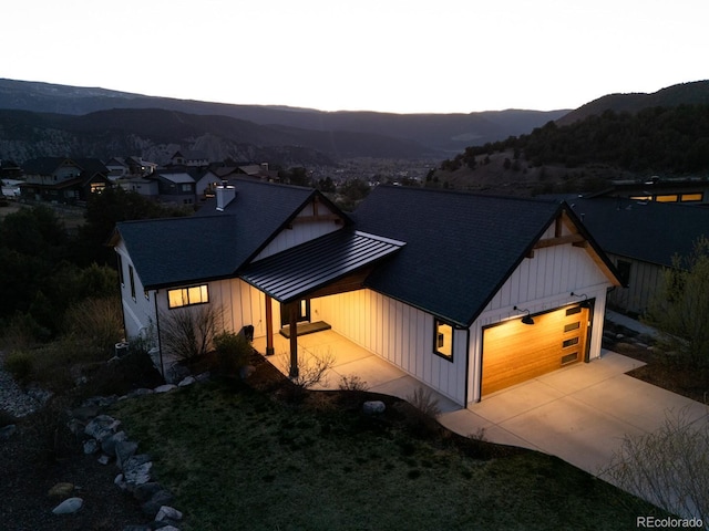 103 Paintbrush Way, Glenwood Springs, CO 81601 - view of front of property featuring a mountain view, board and batten siding, and an attached garage