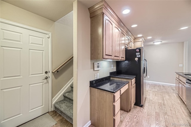 6727 W Yale Ave, Lakewood, CO 80227 - kitchen featuring light wood finished floors, stainless steel appliances, baseboards, dark stone countertops, and recessed lighting