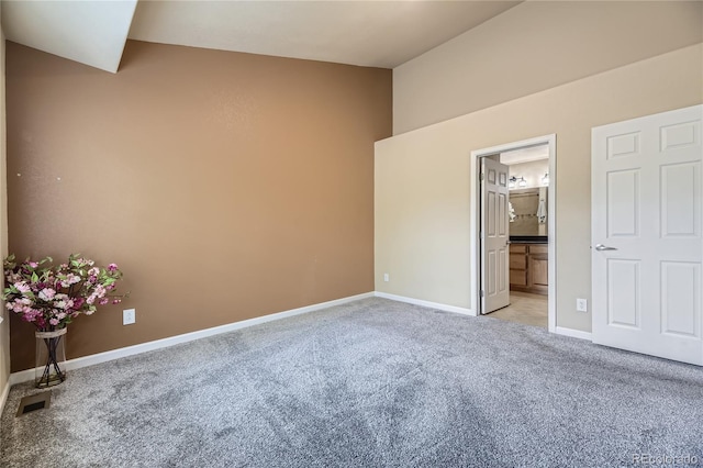 6727 W Yale Ave, Lakewood, CO 80227 - unfurnished bedroom featuring light colored carpet, baseboards, and ensuite bathroom