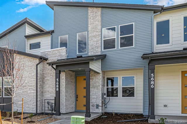 view of property with stone siding
