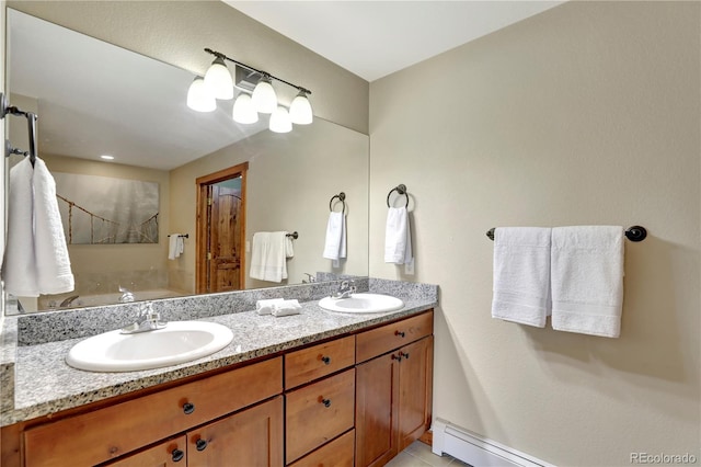 full bathroom featuring a sink, a baseboard radiator, double vanity, and tile patterned flooring