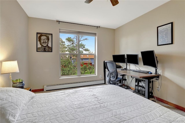 bedroom featuring ceiling fan, baseboards, and a baseboard radiator