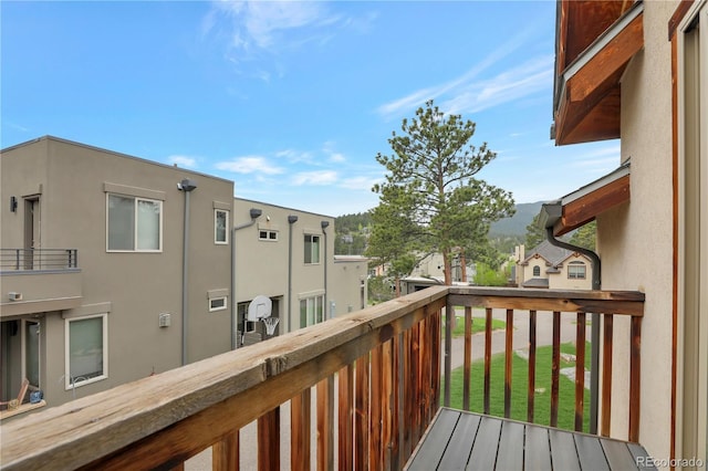 wooden terrace with a residential view