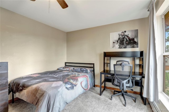 bedroom featuring baseboards, a ceiling fan, a baseboard heating unit, and carpet