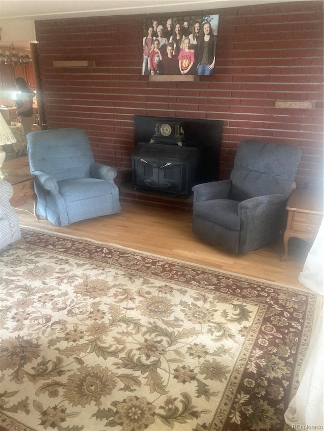 14751 E 24th Ave, Aurora, CO 80011 - living room with wood finished floors and a wood stove