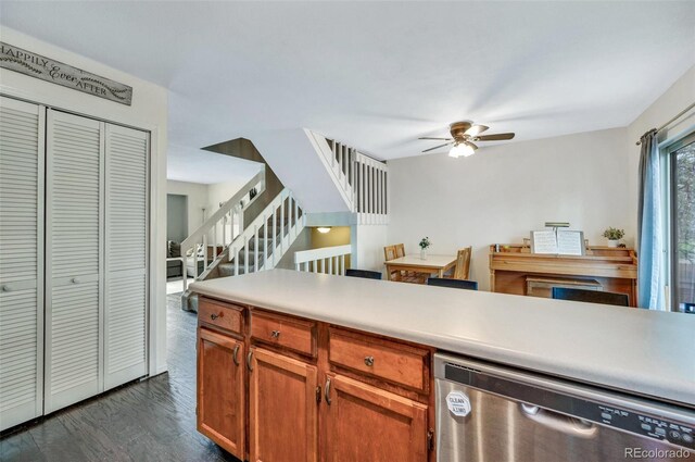 3831 Smoke Tree Dr, Colorado Springs, CO 80920 - kitchen featuring ceiling fan, light countertops, brown cabinetry, dark wood-type flooring, and stainless steel dishwasher