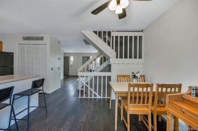 3831 Smoke Tree Dr, Colorado Springs, CO 80920 - dining area with baseboards, a ceiling fan, wood finished floors, and stairway