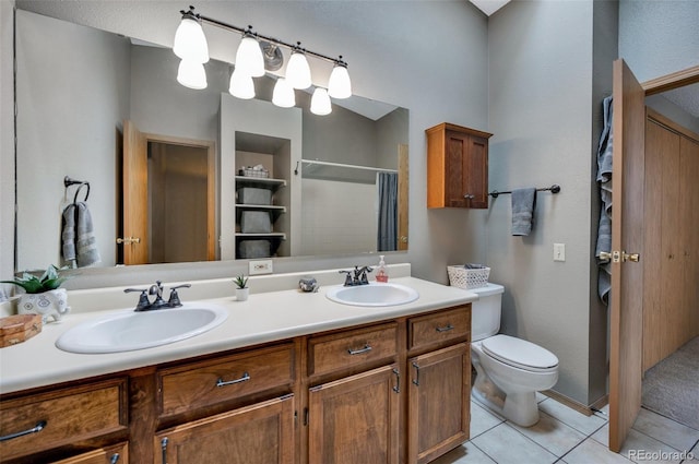 3831 Smoke Tree Dr, Colorado Springs, CO 80920 - bathroom with a sink, a shower with shower curtain, tile patterned floors, and toilet