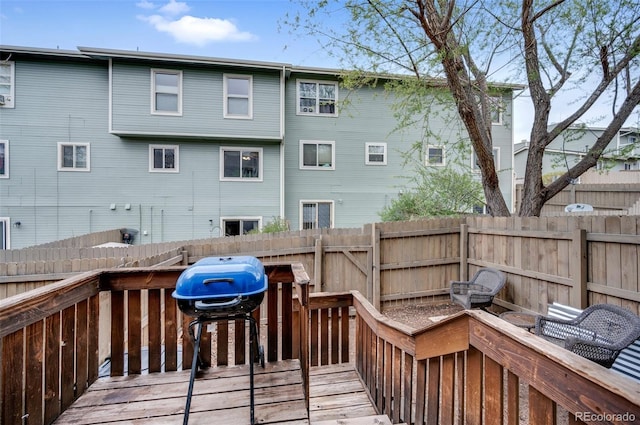 3831 Smoke Tree Dr, Colorado Springs, CO 80920 - wooden deck with a fenced backyard and a grill