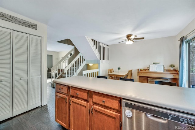 3831 Smoke Tree Dr, Colorado Springs, CO 80920 - kitchen with stainless steel dishwasher, a ceiling fan, dark wood-style flooring, light countertops, and brown cabinetry