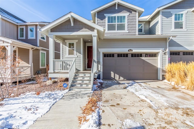 view of front of house featuring a garage and covered porch