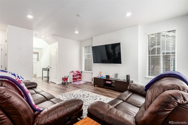 living room with recessed lighting and wood finished floors