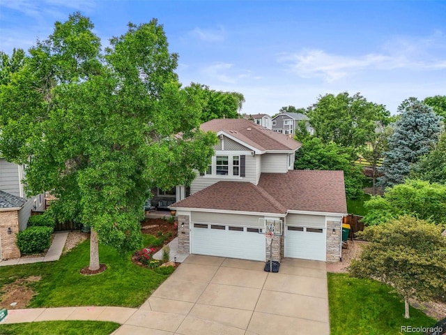 6105 W Long Dr, Littleton, CO 80123 - view of front of property featuring stone siding, concrete driveway, a front yard, a shingled roof, and an attached garage