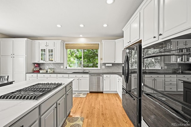 6105 W Long Dr, Littleton, CO 80123 - kitchen with stainless steel appliances, backsplash, gray cabinetry, light wood-style flooring, and recessed lighting