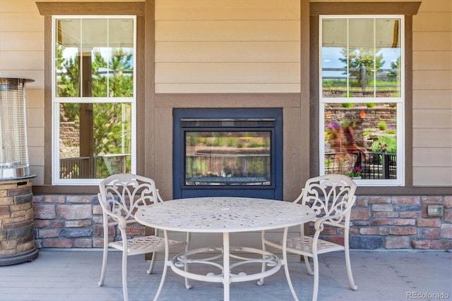 24322 E Mineral Dr, Aurora, CO 80016 - view of patio / terrace with a glass covered fireplace