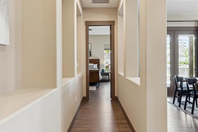 24322 E Mineral Dr, Aurora, CO 80016 - corridor featuring dark wood-type flooring and plenty of natural light