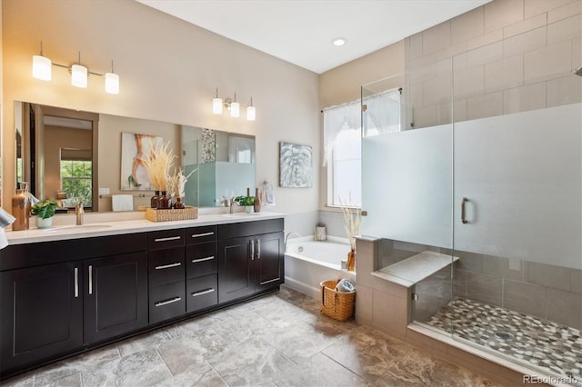 24322 E Mineral Dr, Aurora, CO 80016 - bathroom with double vanity, a shower stall, and a bath