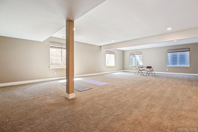 24322 E Mineral Dr, Aurora, CO 80016 - unfurnished living room featuring carpet flooring and recessed lighting