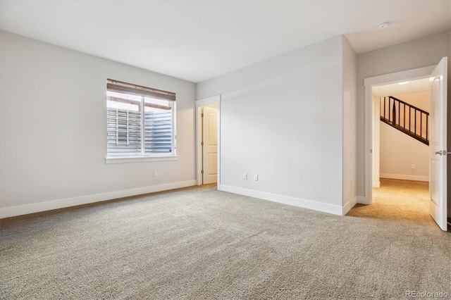 24322 E Mineral Dr, Aurora, CO 80016 - carpeted empty room featuring baseboards and a smoke detector