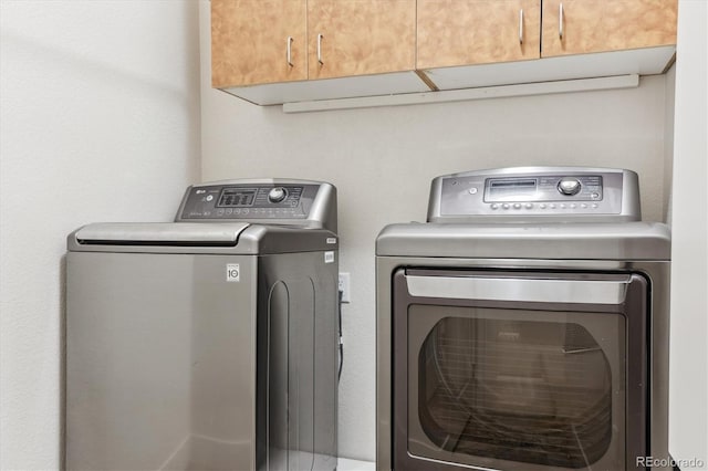 24322 E Mineral Dr, Aurora, CO 80016 - washroom featuring cabinet space and separate washer and dryer