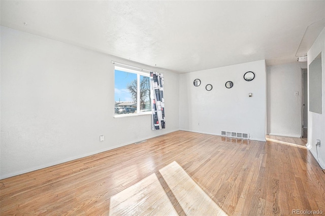 unfurnished room featuring light wood-type flooring