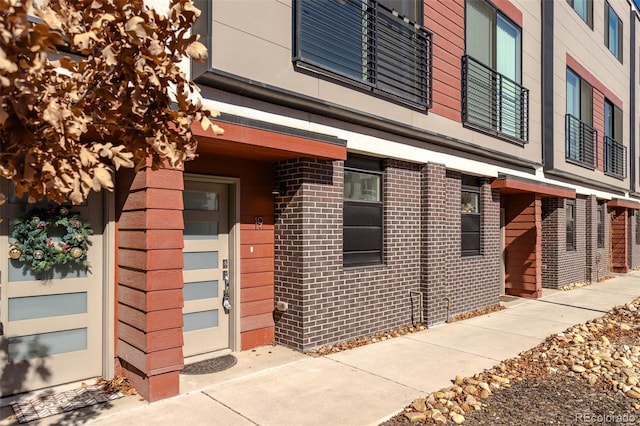 exterior space with brick siding