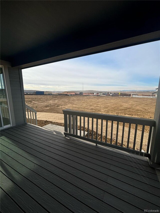 wooden terrace with a rural view