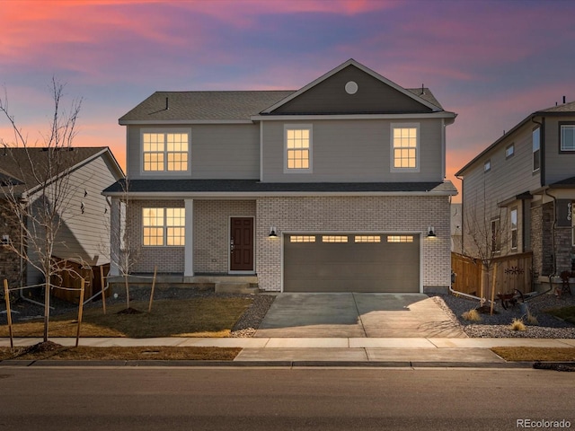 traditional-style home with brick siding, a garage, driveway, and roof with shingles