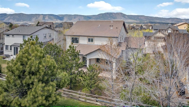 16043 Bridle Ridge Dr, Monument, CO 80132 - aerial view of property's location with nearby suburban area and a mountain backdrop