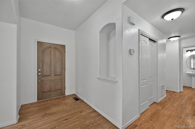 16043 Bridle Ridge Dr, Monument, CO 80132 - entrance foyer with light wood-style floors and baseboards