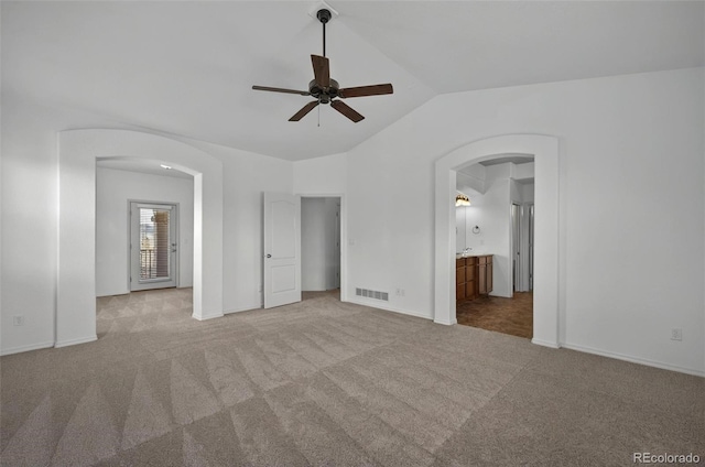 16043 Bridle Ridge Dr, Monument, CO 80132 - unfurnished bedroom with arched walkways, lofted ceiling, carpet floors, and baseboards