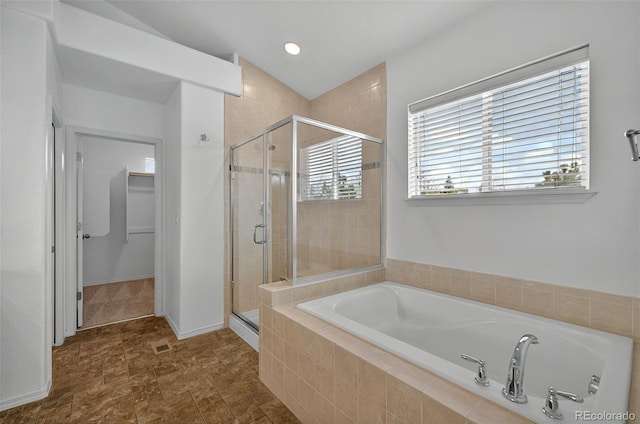 16043 Bridle Ridge Dr, Monument, CO 80132 - bathroom featuring a shower stall, a bath, and a spacious closet