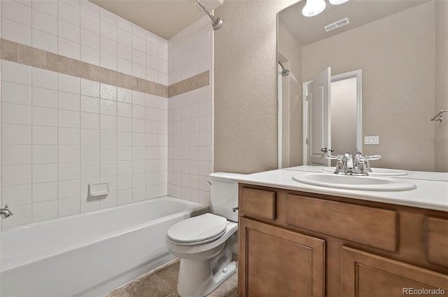 16043 Bridle Ridge Dr, Monument, CO 80132 - bathroom with toilet, a textured wall, tub / shower combination, vanity, and tile patterned floors