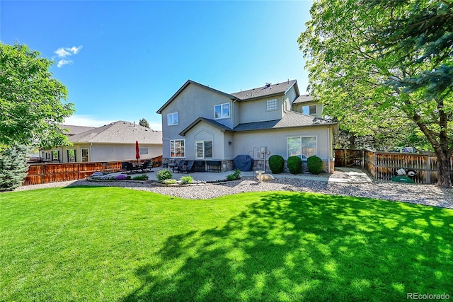 8427 S Parfet Ct, Littleton, CO 80127 - rear view of house with stucco siding and a patio