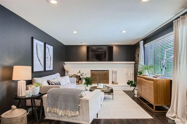 7036 Robb St, Arvada, CO 80004 - bedroom with recessed lighting, wood finished floors, and a fireplace