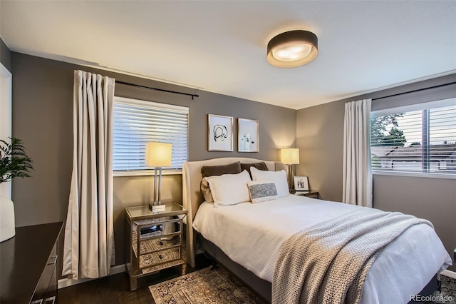 7036 Robb St, Arvada, CO 80004 - bedroom featuring dark wood finished floors and baseboards